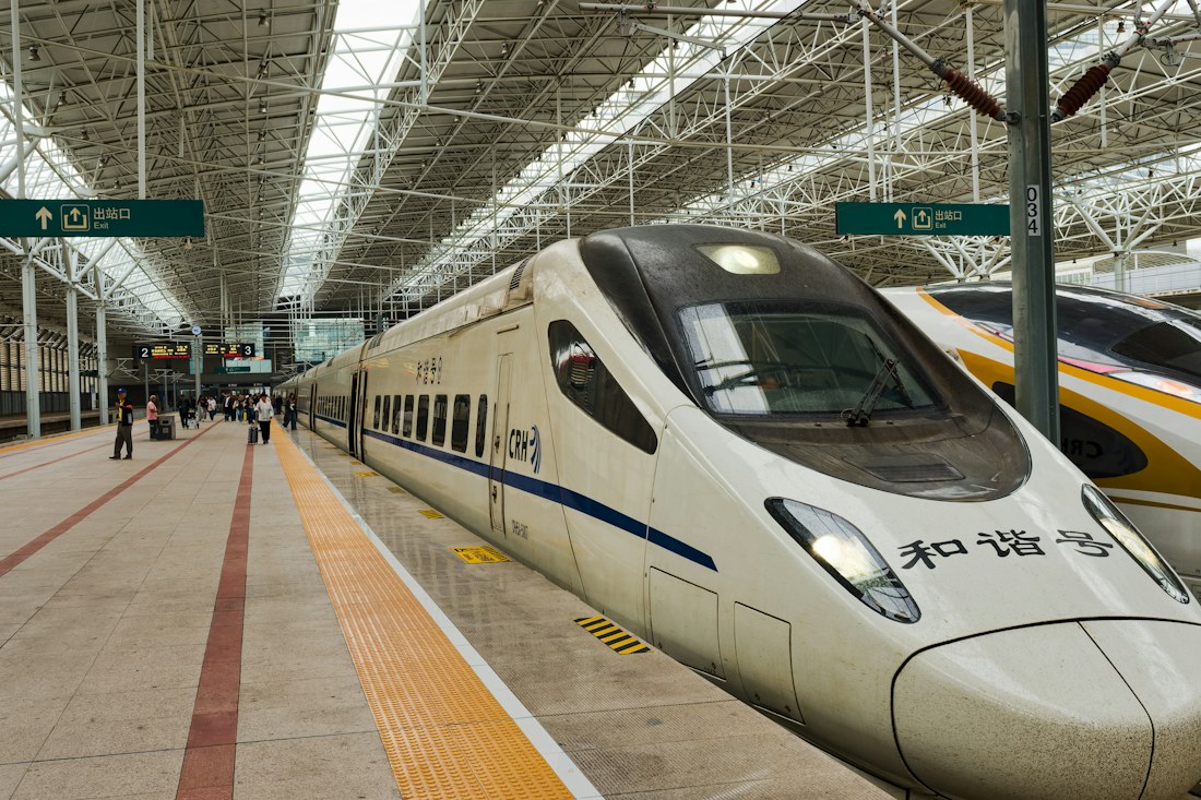 A high-speed train beside a station platform in Beijing